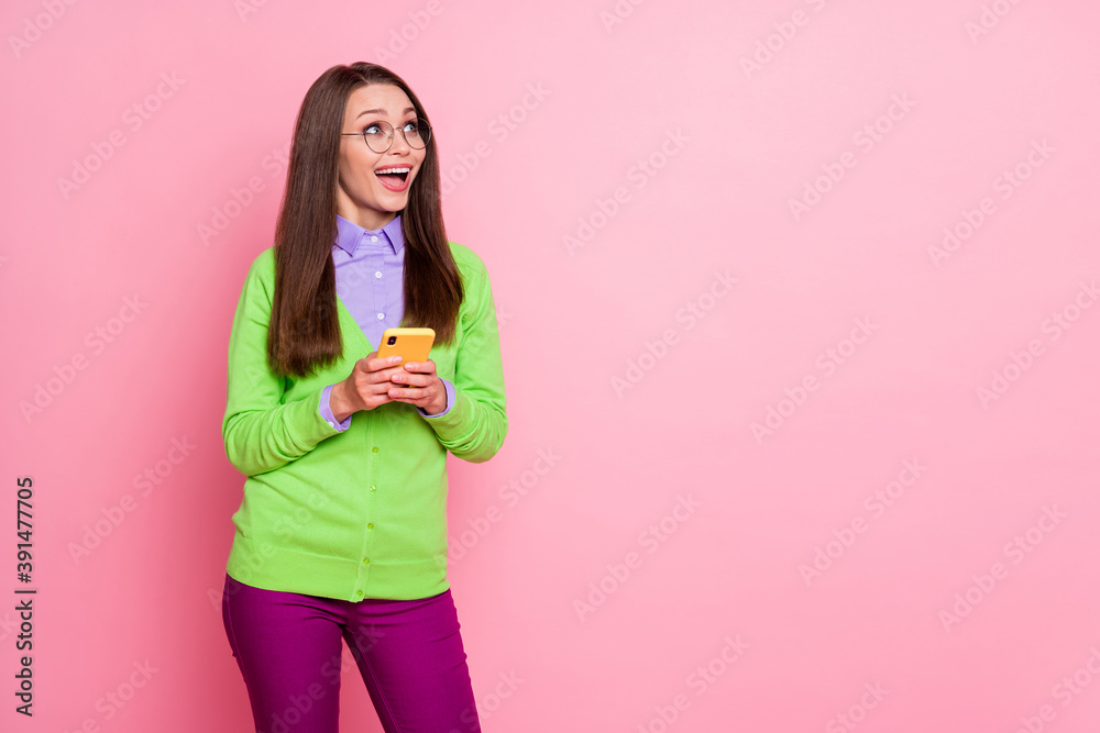 Portrait of shocked girl use cellphone look copyspace wear purple pants trousers isolated pastel color background Portrait of shocked girl use cellphone look copyspace wear purple pants trousers isolated pastel color background
