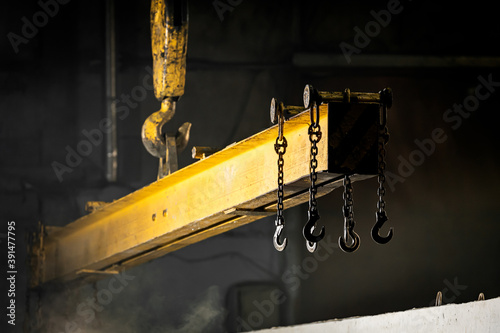 Konstfotografi The crane moves a reinforced concrete product with holes
