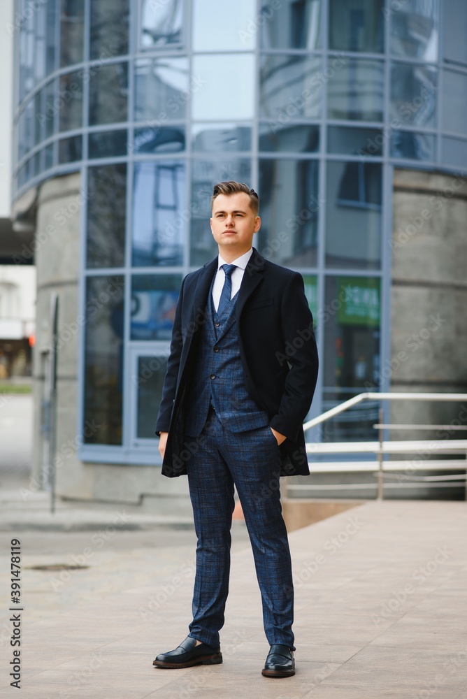 young business man, wearing stylish classic suit young business man, wearing stylish classic suit