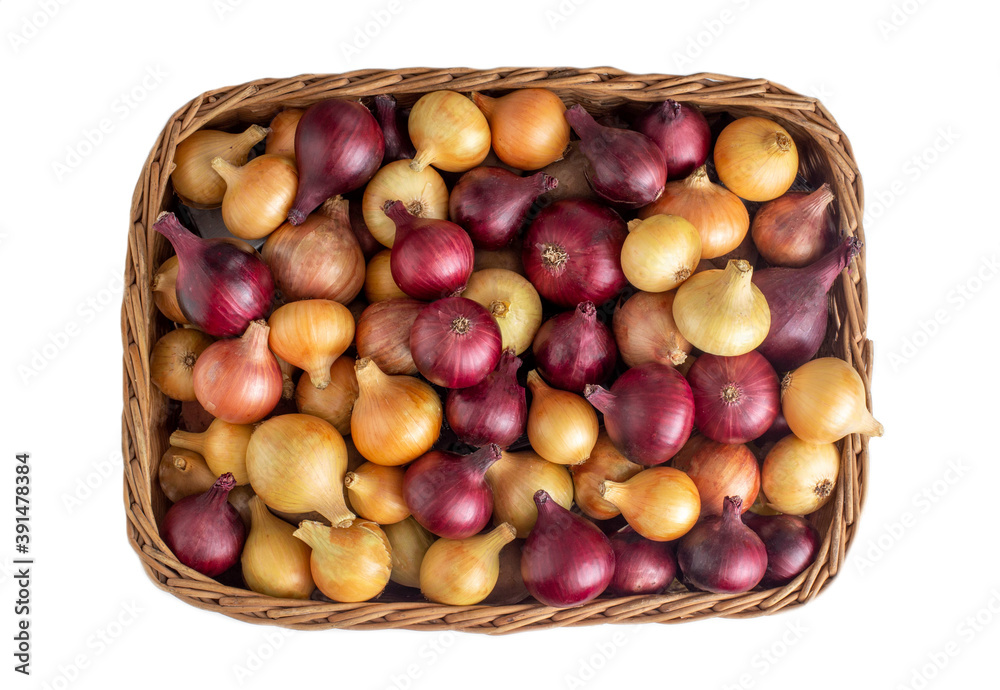 Multicolored yellow and red onions in a wicker basket on a white background, isolate, vegetable Multicolored yellow and red onions in a wicker basket on a white background, isolate, vegetable