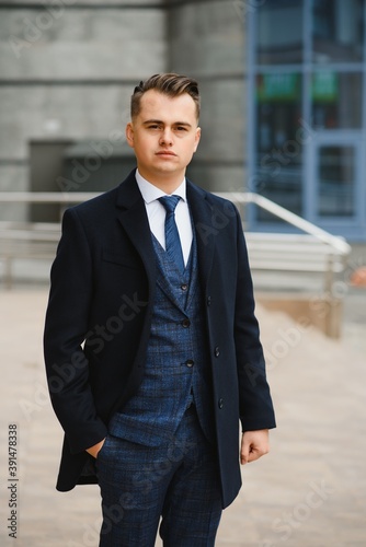 Fashion shot of a handsome young man in elegant classic suit. Men's beauty, fashion.