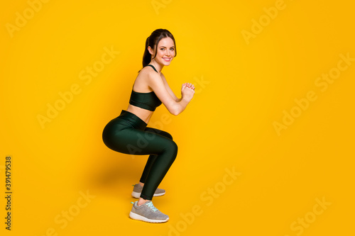 Full length body size profile side view of her she nice pretty cheerful girl doing sit-ups training isolated over bright yellow color background