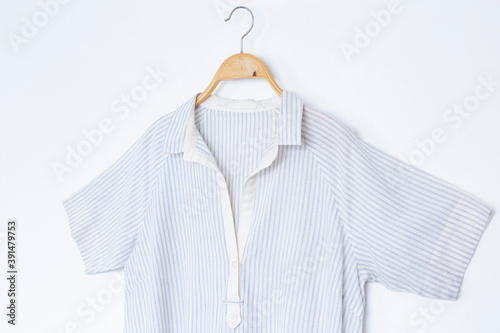 Woman blouse with summer blouse cotton on white background. © Pornpawit