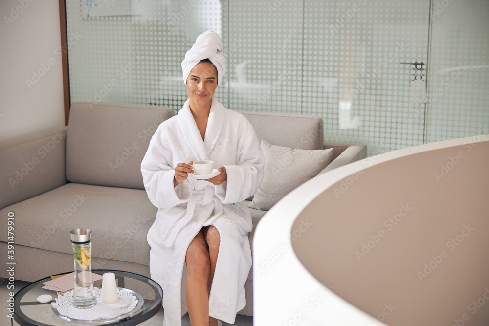 Client drinking tea in a luxury salon Client drinking tea in a luxury salon