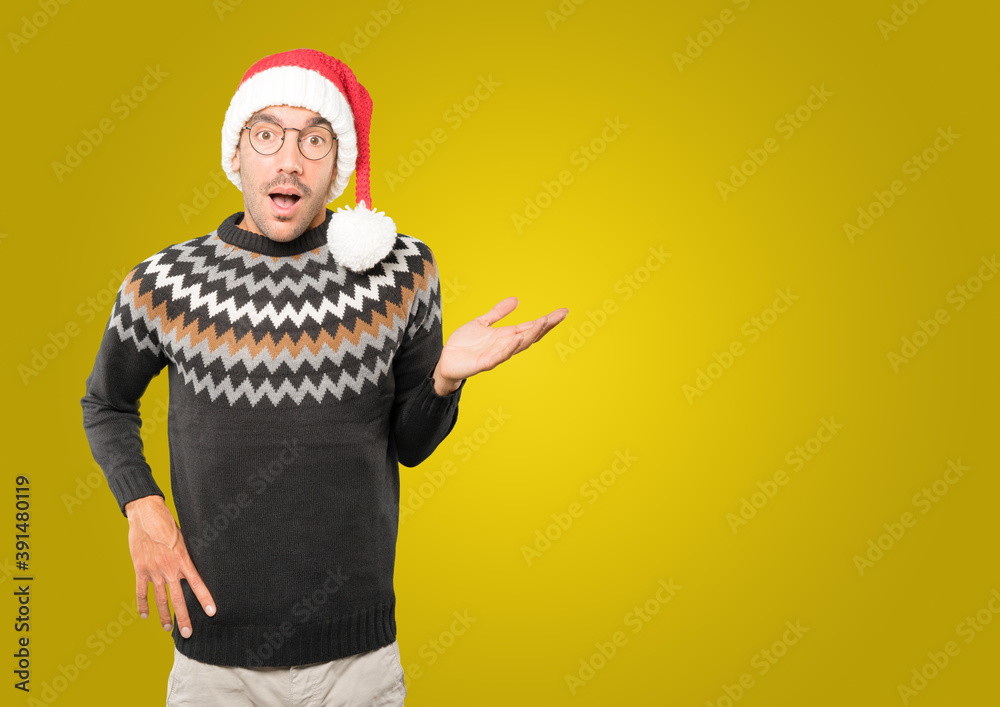 Christmas - Young man gesturing Christmas - Young man gesturing