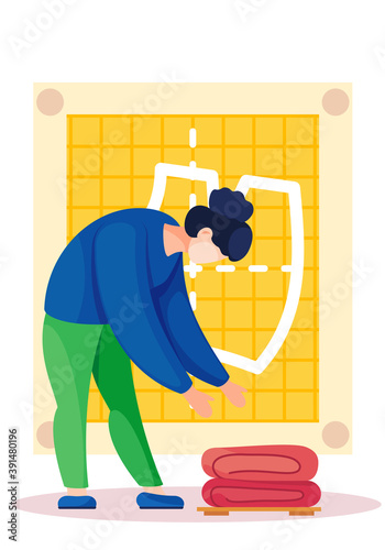 The beautiful girl bends over to fold the blankets. Night cleaning in the apartment. Preparation for sleep. A woman tidies up the bedding on the background of a yellow pattern. Folding the fabric