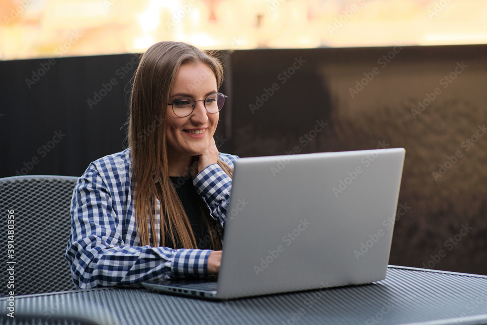 The programmer girl works at the computer Girls in science. In an empty office during a pandemic. The programmer girl works at the computer Girls in science. In an empty office during a pandemic.