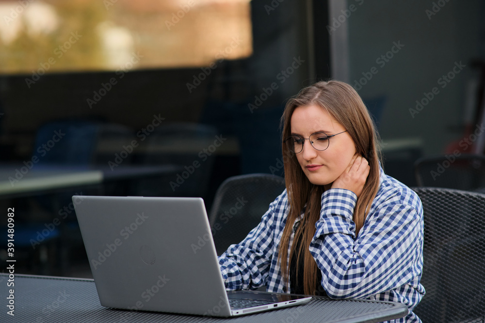 The programmer girl works at the computer Girls in science. In an empty office during a pandemic. The programmer girl works at the computer Girls in science. In an empty office during a pandemic.