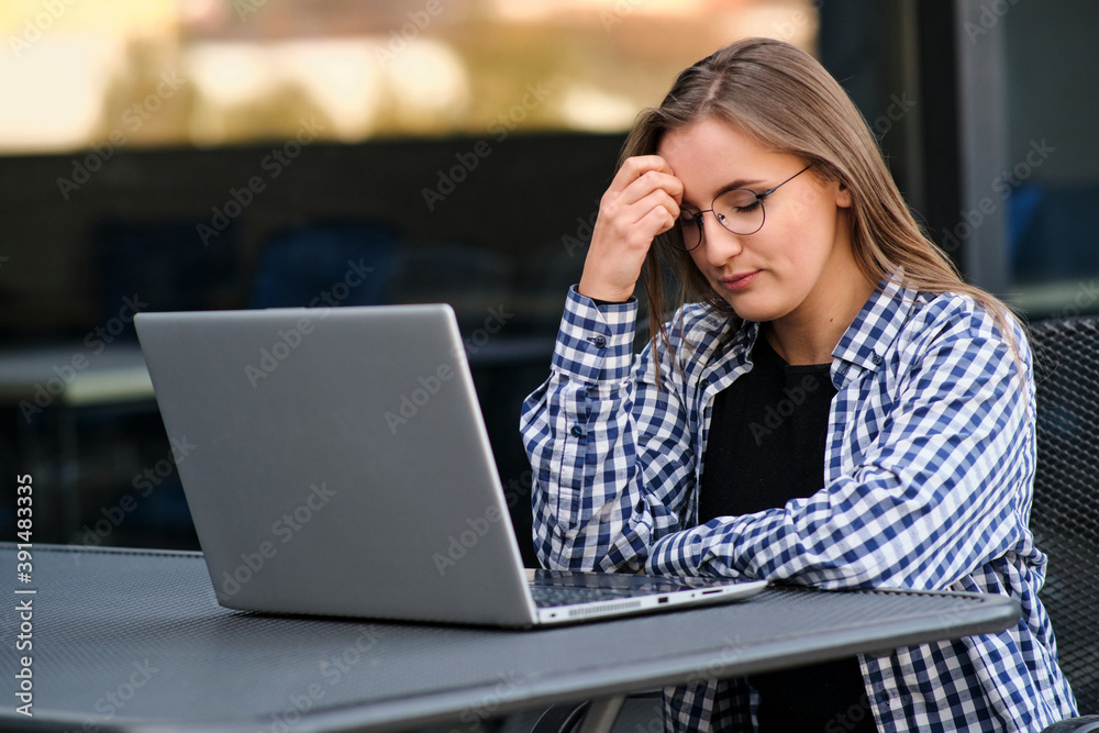 The programmer girl works at the computer Girls in science. In an empty office during a pandemic. The programmer girl works at the computer Girls in science. In an empty office during a pandemic.