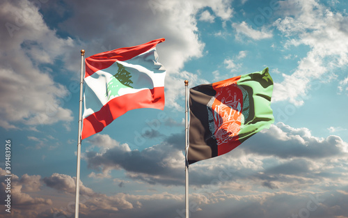 Beautiful national state flags of Lebanon and Afghanistan together at the sky background. 3D artwork concept.