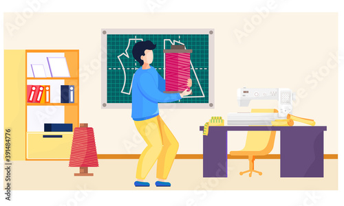 Sewing with designer or seamstress working with spool. Professional tailoring studio. Man carries pink threads in his hands to a sewing machine. Creative environment for a man seamstress in work area