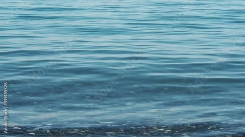 Blue water ripples. Sea or lake surface. Abstract wavy background