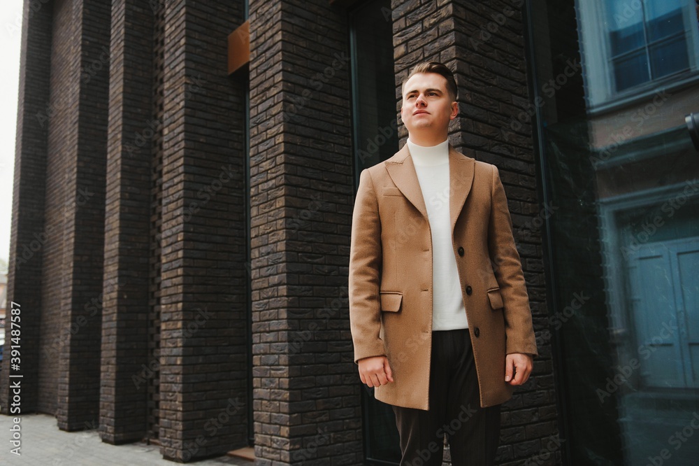 Stylish elegant men man in coat in urban style Stylish elegant men man in coat in urban style