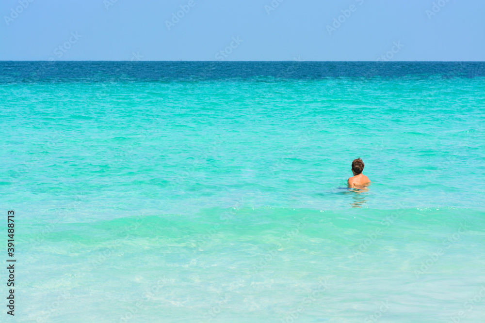 Man swimming in the sea.
