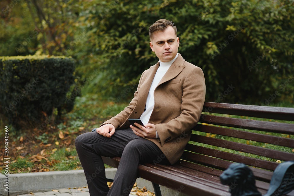 Stylish elegant men man in coat in urban style Stylish elegant men man in coat in urban style