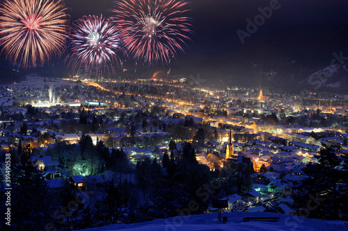 firework on sky over german city Garmisch-Partenkirchen at cold winter night © Wolfilser