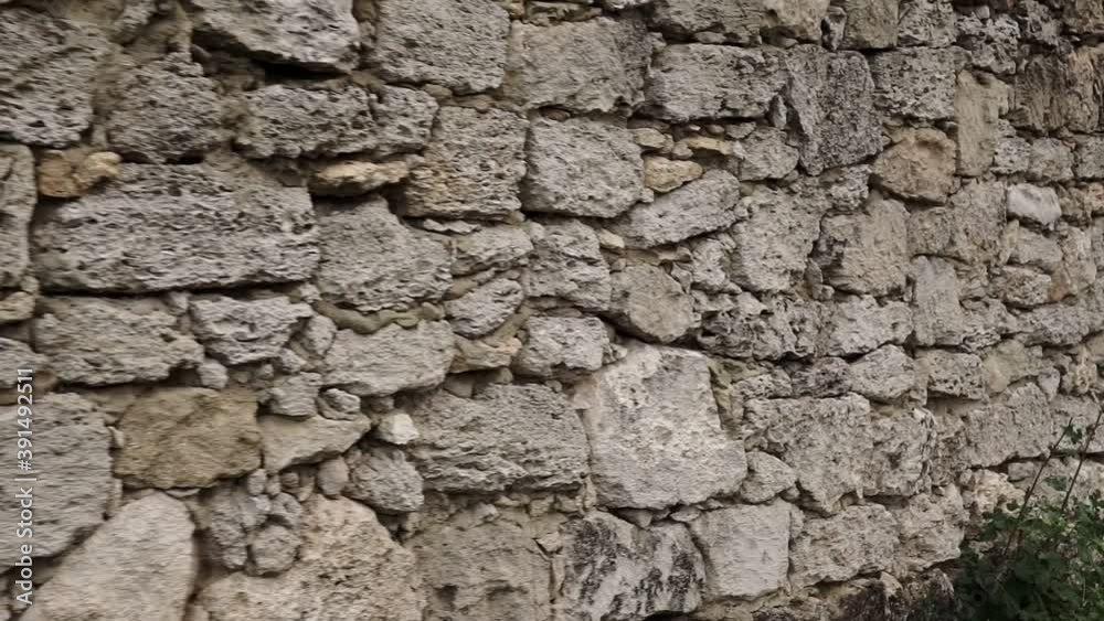 Texture of a stone wall. Old castle stone wall texture background. Stone wall as a background or texture. Camera moving. Texture of a stone wall. Old castle stone wall texture background. Stone wall as a background or texture. Camera moving.
