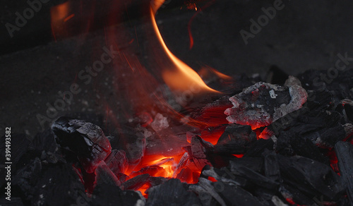 Bild auf Leinwand barbecue in the garden, close-up of glowing embers, grill in the garden, burins