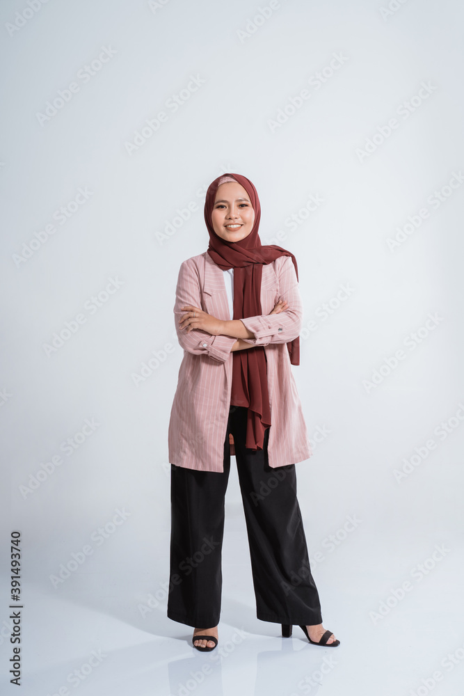 Happy business muslim woman portrait. Showing copy space on white background Happy business muslim woman portrait. Showing copy space on white background