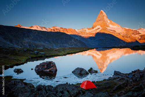 Famous peak Matterhorn in red sunlight. Location place Switzerland, Swiss alps, Europe.