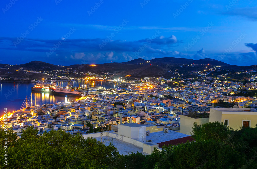 Evening view of the city of Ermoupoli, the capital town of Syros island, in Cyclades, Aegean sea, Greece.