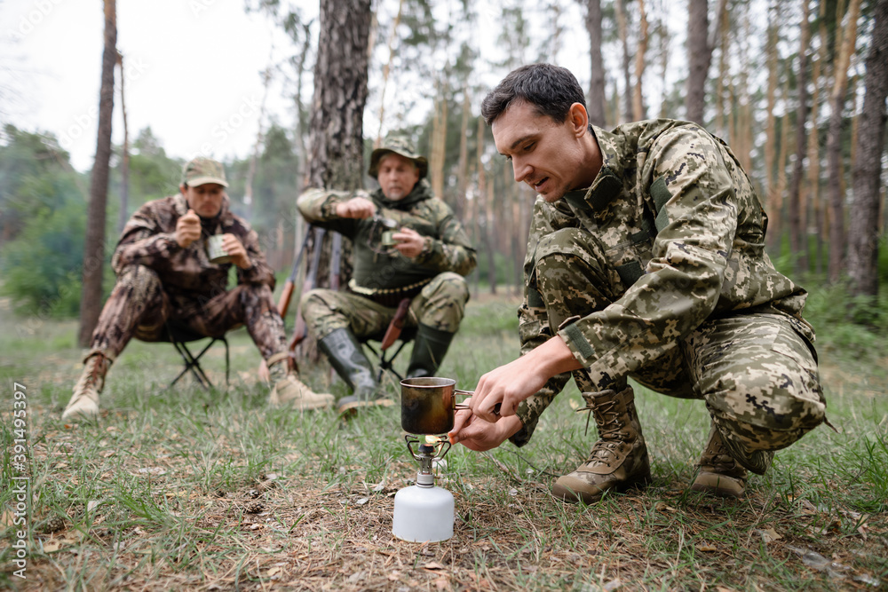 Hikers Have Lunch Cooking with Portable Burner. Hikers Have Lunch Cooking with Portable Burner.