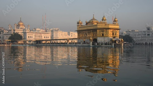 Golden temple, the holiest shrine of Sikhism reflection on the pool. photo