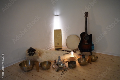 Sound healing session with many sound healing instruments like singing bowls, koshi chimes, drum, sansula and zimbel. photo