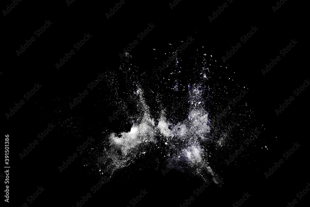 Obraz premium White powder or flour explosion isolated on black background.