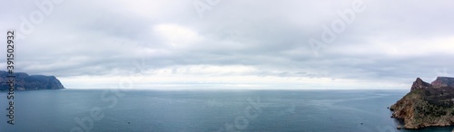 view from the cliff to the sea and ships in it