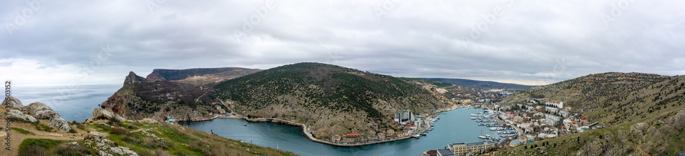 panorama of mountains and bay with ships