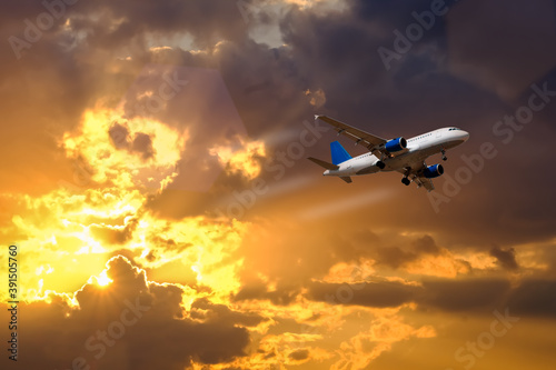 airplane fly over dramatic sunset