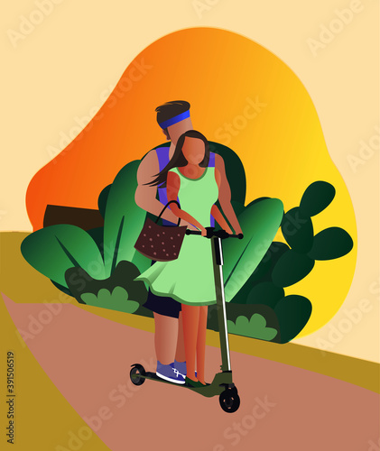 Man and woman riding on two wheel kick scooter. Happy couple on bicycle in park with green bushes and yellow sunlight background.