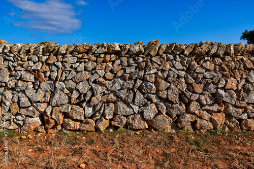 wall background with orange stones and dirt