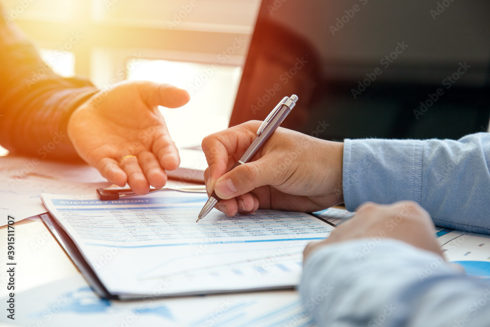 Two young businessmen using touchpad at meeting, People Meeting Design Ideas Concept. business planning. Two young businessmen using touchpad at meeting, People Meeting Design Ideas Concept. business planning.