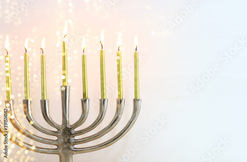Religion image of jewish holiday Hanukkah background with menorah (traditional candelabra) and candles
