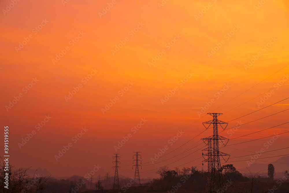 Electricity poles  and landscape in the evening at sunset