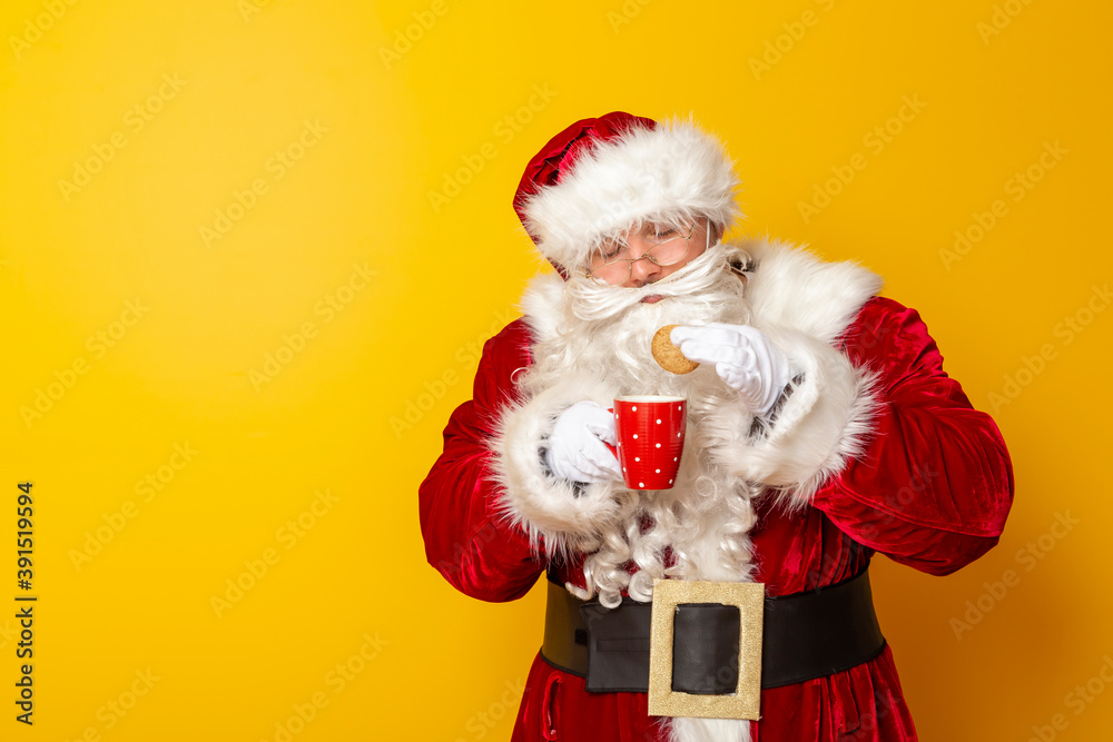 Santa Claus eating cookies and drinking milk