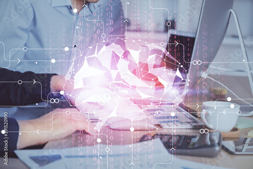 Man with computer background with brain theme hologram. Concept of brainstorm. Double exposure.