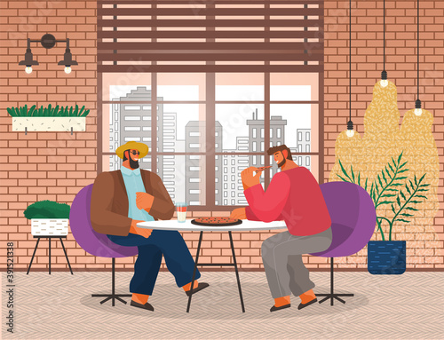 Two men friends sitting at a table eating pizza in pizzeria. Stylish male characters having lunch in restaurant with loft style interior with brick wall. Business partners has dinner in a cafe