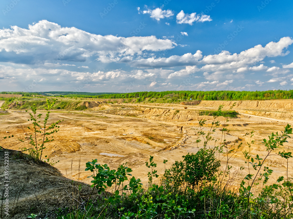 Naklejka premium A quarry and excavators equipment in landscapes.