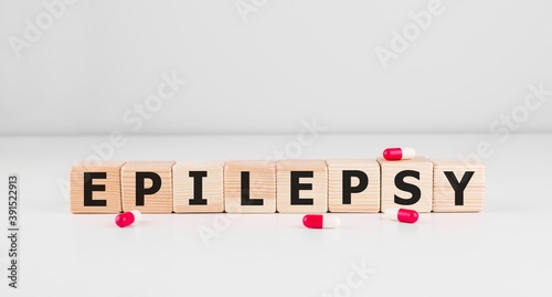 EPILEPSY word on wooden cubes, background. Concept of epilepsy awareness