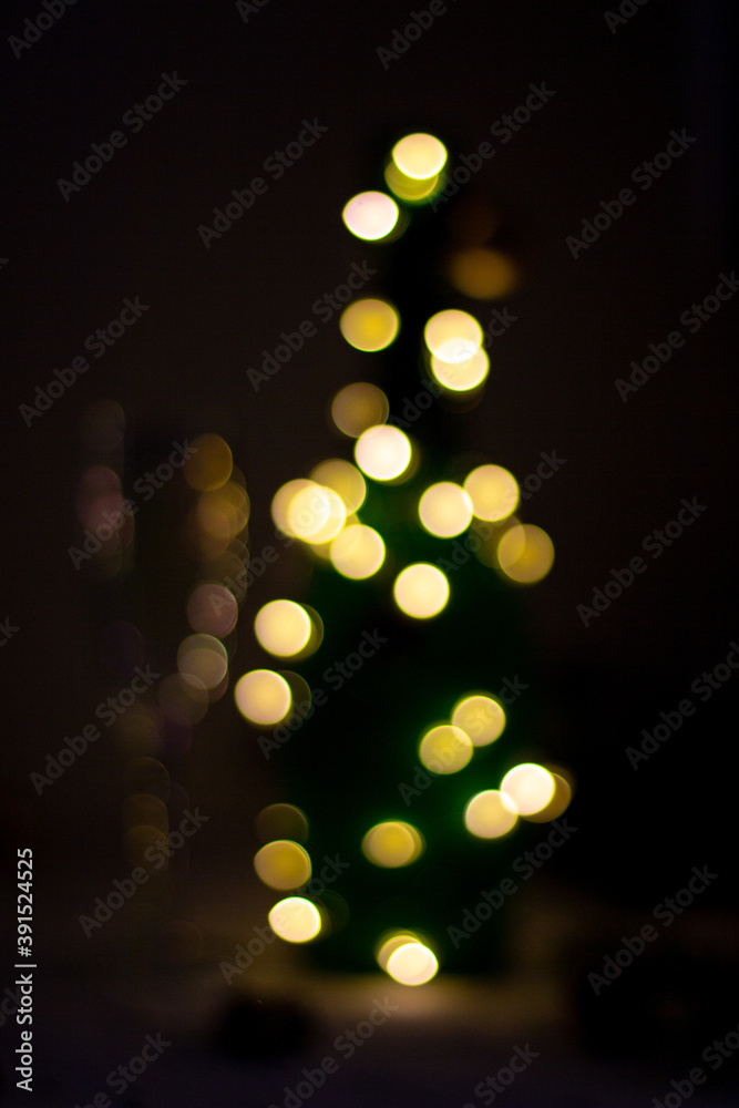 Fototapeta premium gold light bokeh in form of bottle or christmas tree