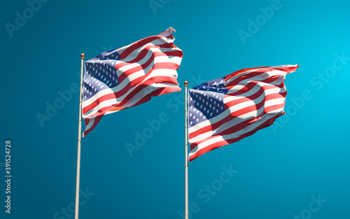 Beautiful national state flags of USA and USA together at the sky background. 3D artwork concept.