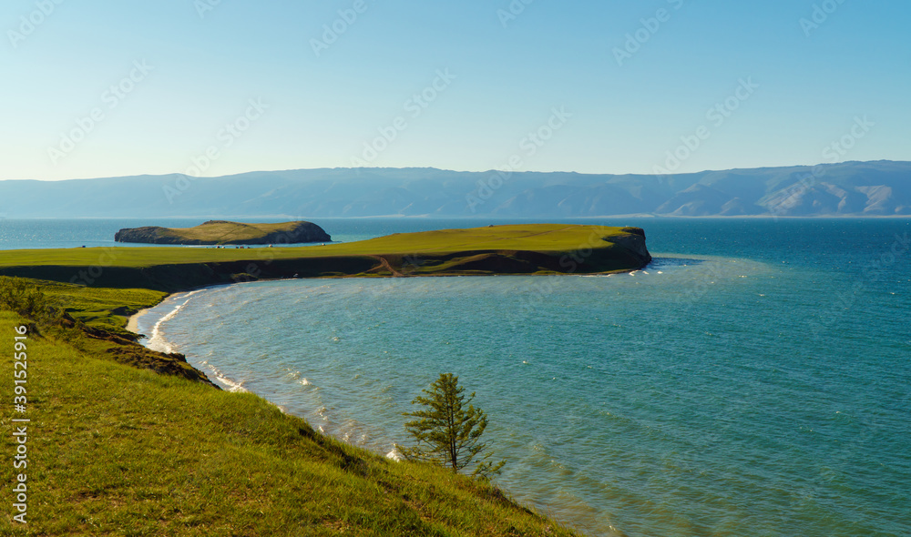 beautiful landscape of the beautiful lake shore. Summer Sunny day, clear sky. Natural background. Olkhon island-heart of lake Baikal is considered one of the most beautiful places.
