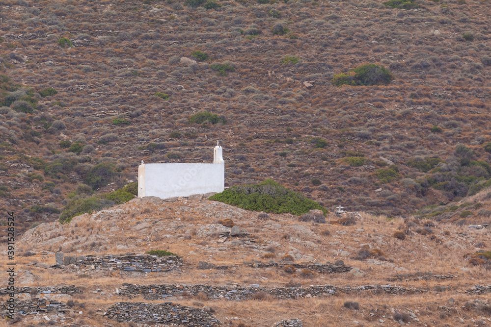 Fototapeta premium Traditional white chapel , Ios island, Greece.