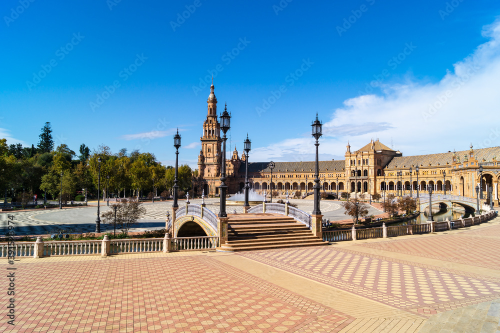 General view of the Plaza de España in Seville with its main building, the South Tower and the fountain located in the center of the square (Spain). Emblematic place next to the María Luisa park.