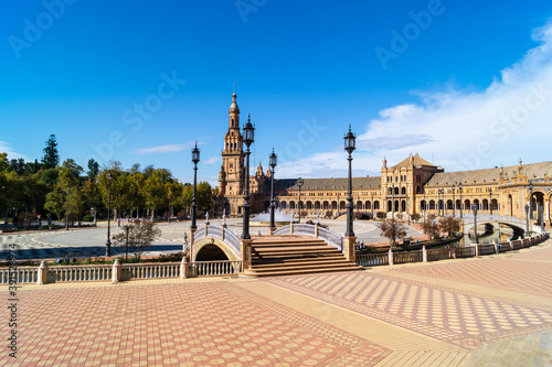 General view of the Plaza de España in Seville with its main building, the South Tower and the fountain located in the center of the square (Spain). Emblematic place next to the María Luisa park.