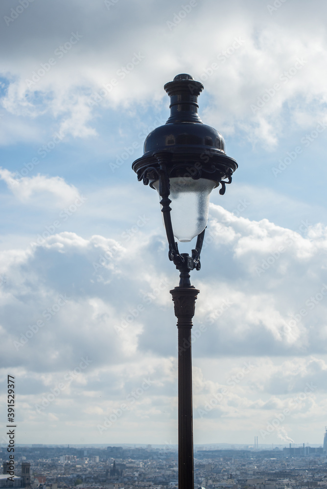 Closeup of street light on roofs of Paris from Montmartre quarter background