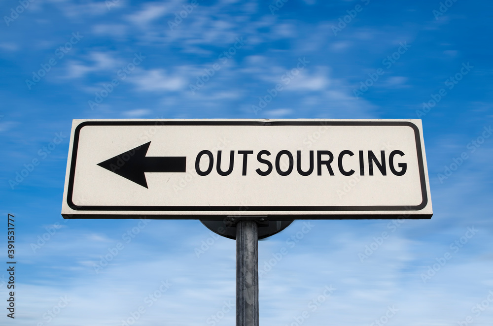Outsourcing work force. White sign with arrow with offshore. Direction sign. Arrows on a pole pointing in one direction. IT offshoring concept. Outsourcing work force. White sign with arrow with offshore. Direction sign. Arrows on a pole pointing in one direction. IT offshoring concept.